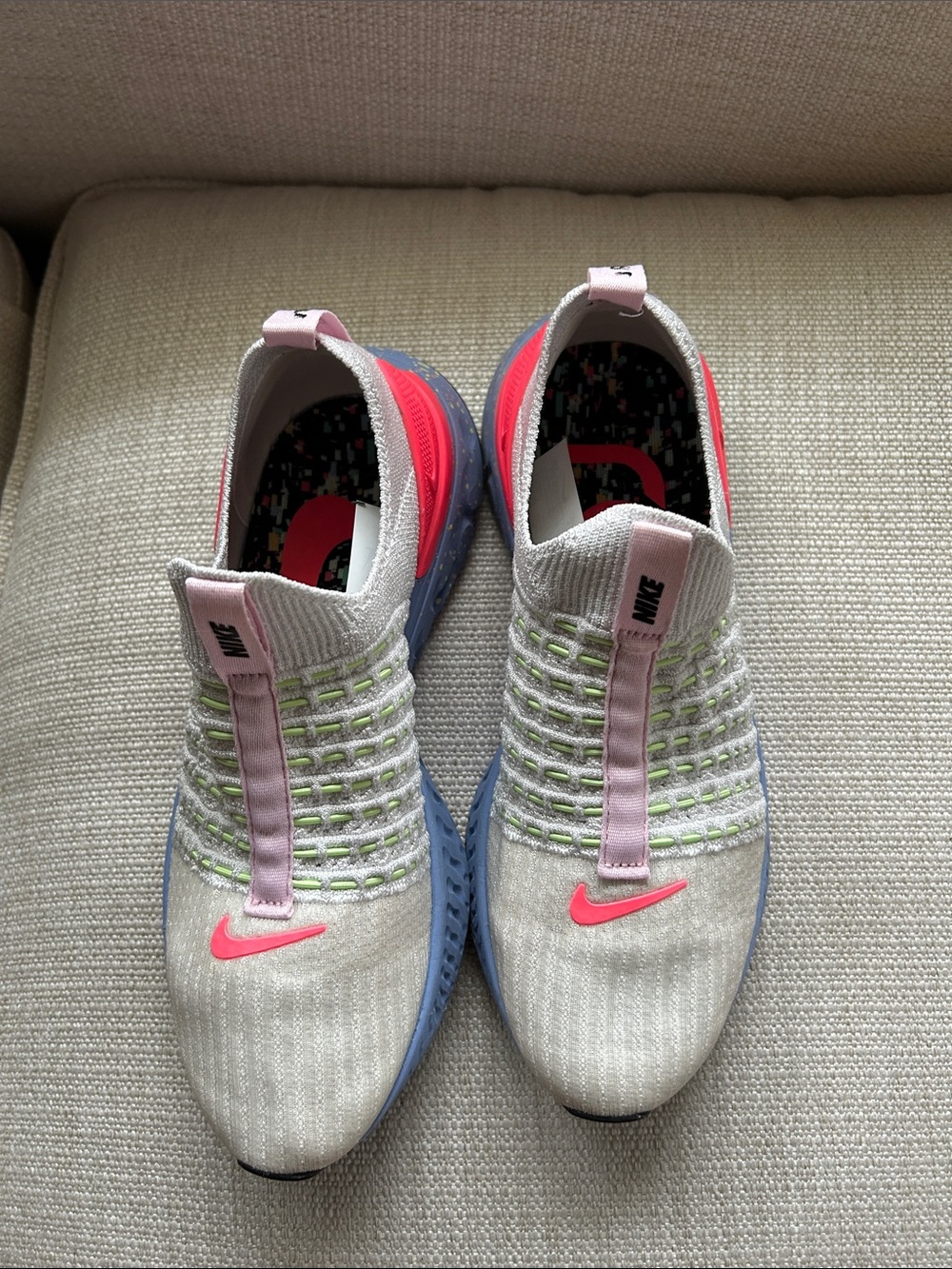 Nike Women’s Gray Knit Slip-On Sneakers with Pink and Blue Accents